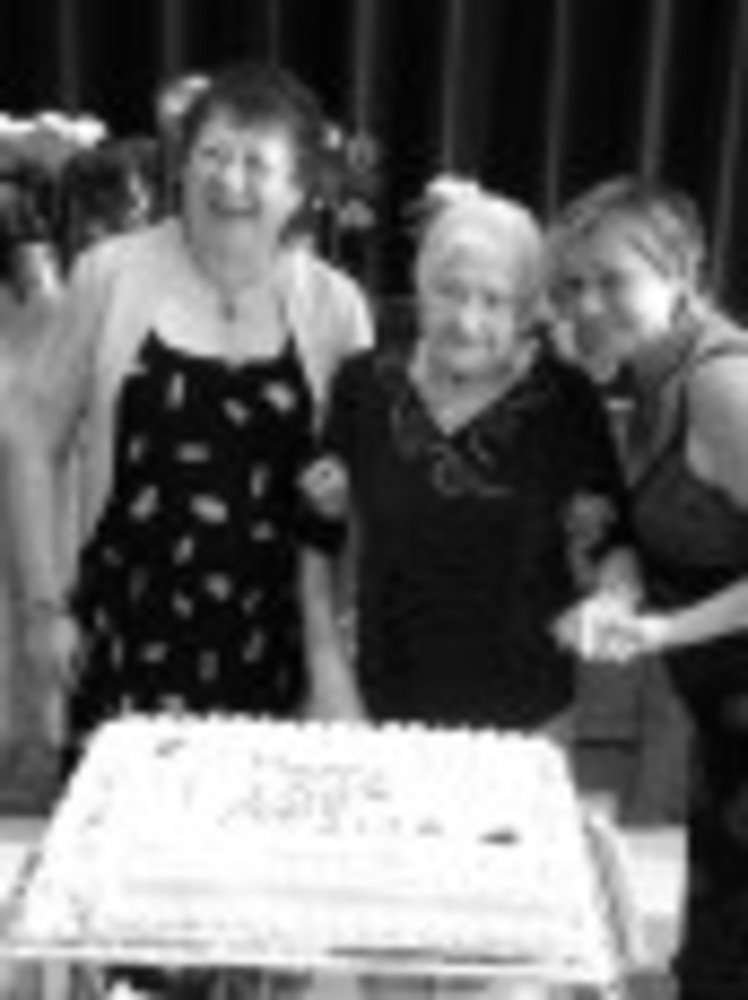 Otilia (Tanya) Plungyan, center, and her daughters, Sophia Friedman, left, and Ella Levin, at the birthday party for Plungyan.  /PATTY HARWOOD
